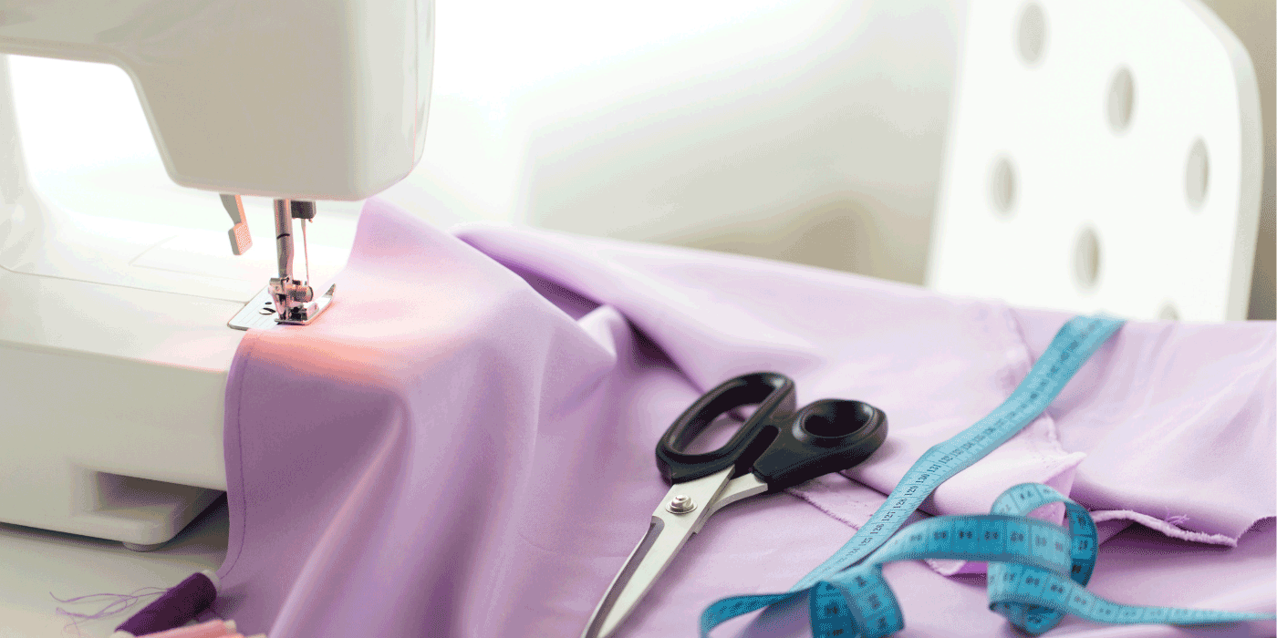 how do you feed fabric to a sewing machine