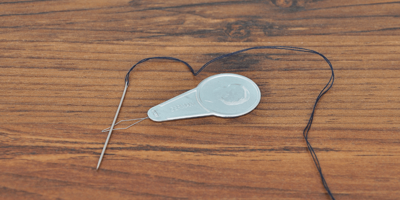 how to use a singer needle threader assistant
