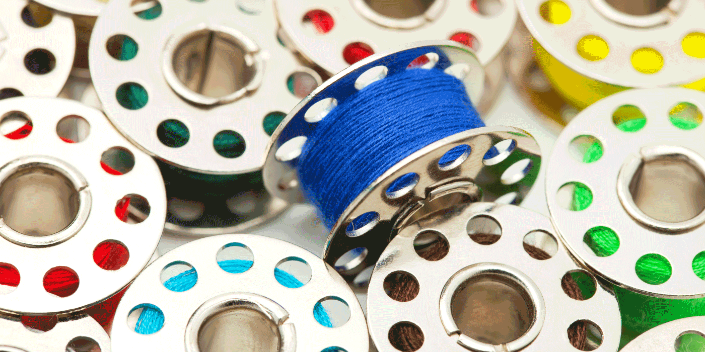 how do you wind a bobbin on a handheld sewing machine